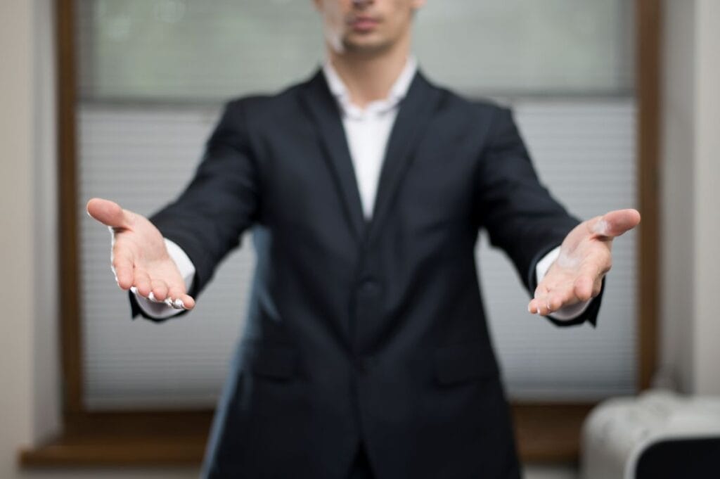 front view businessman with arms - Glowbiz Solutions Which is Right for Your Business?